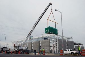 A Crane Truck On A City Street